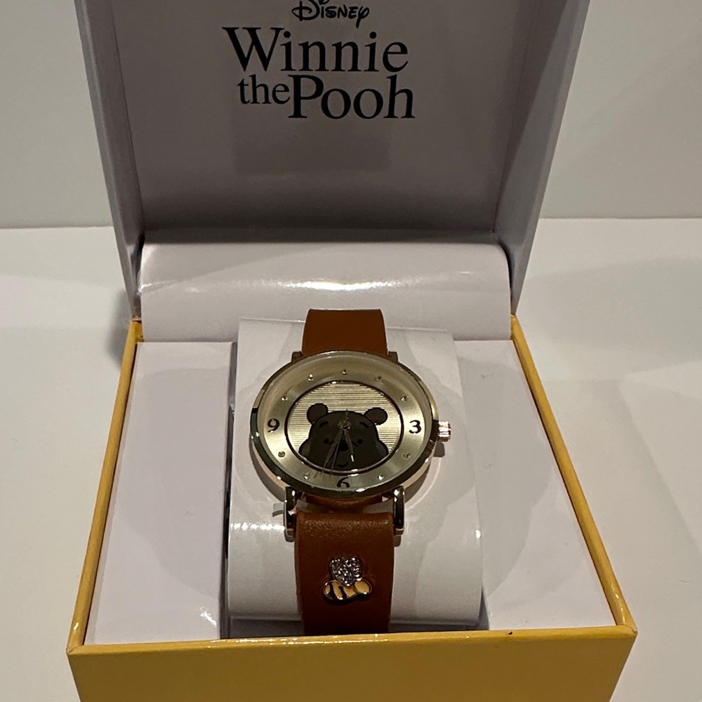 NWT Disney Winnie the Pooh Wrist watch with Goldtone Face and Analog movement.